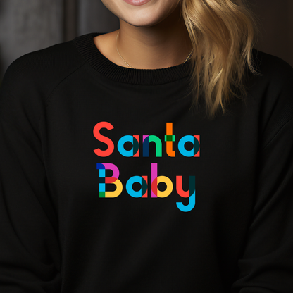 Juodas moteriškas džemperis su ryškiaspalviu "Santa Baby" užrašu. Stilingas ir žaismingas dizainas, puikiai tinkantis šventiniam sezonui. Unikalus Designedbyme.lt kūrinys, atspindintis modernų ir linksmą požiūrį į Kalėdas. Moteriškas džemperis "Santa Baby" Black, Moteriški džemperiai,Perkamiausi džemperiai,Naujausi dizainai, Kalėdinių džemperių kolekcija